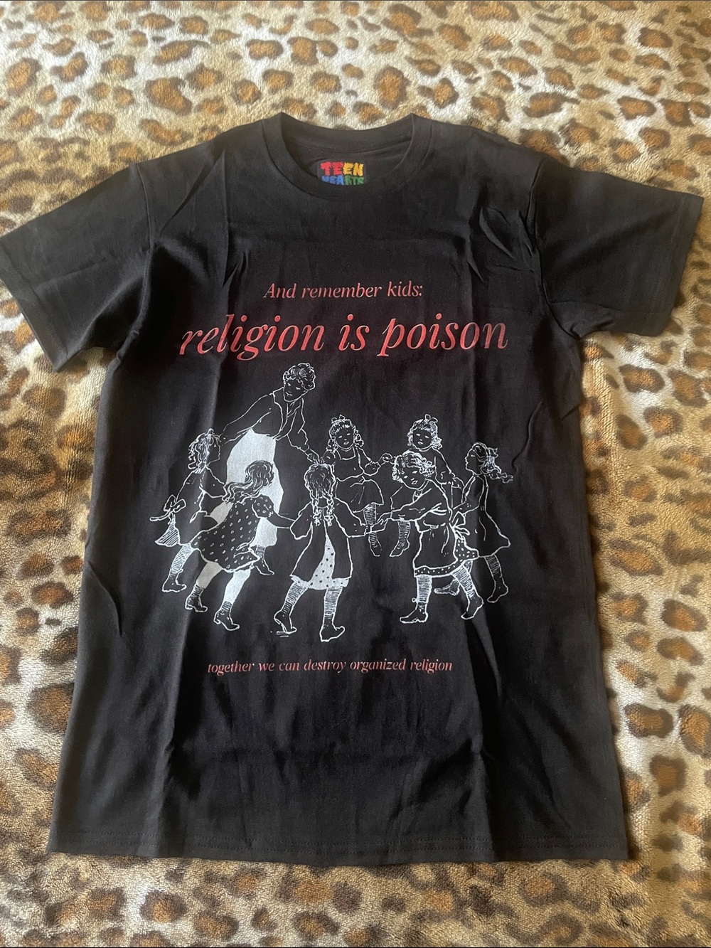 Teen Hearts Black Short Sleeve Graphic Tee - "Religion Is Poison"